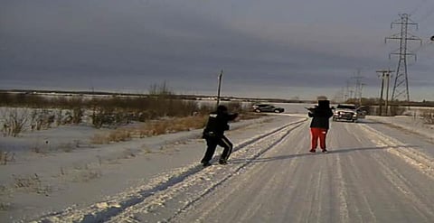 Mountie, left, opens fire as man lowers weapon