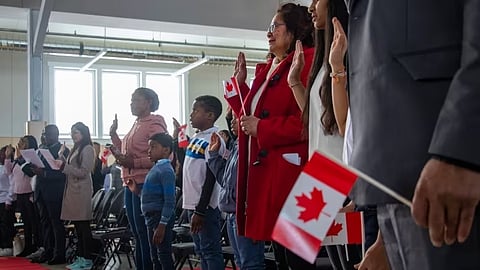 New Canadians take the oath of citizenship in Brandon, MB, on Thursday, Oct. 26, 2023.