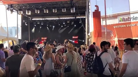 Partygoers crowd near the stage at Nashville North at the Calgary Stampede on July 10, 2021. 