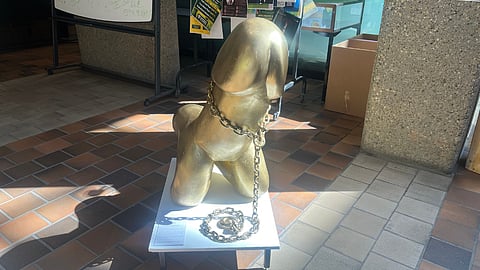 The University of Alberta has put up a statue of a penis sitting like a dog called "Man’s Best Friend" in front of the Rutherford Library North for an art exhibition. 