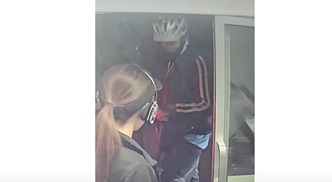 Man spits on cashier