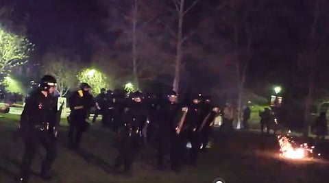 Calgary Police Service moves trespassers off University of Calgary grounds, Thursday.