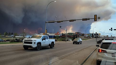 Vehicles evacuating Fort McMurray because of a wildfire. 