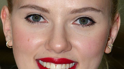 Scarlett Johansson smiles after being pinned with gunnery sergeant rank during a meet and greet on January 20, 2008 in the United Service Organizations' building at Camp Buehring in Kuwait. 