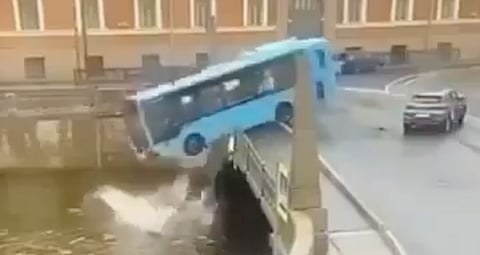 Russian bus plunges into river