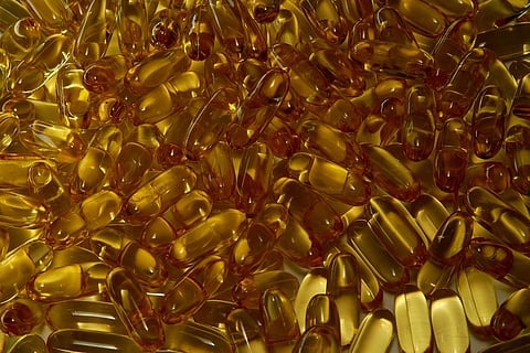 A pile of gelatin capsules containing fish oil. 