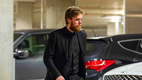 Connor McDavid dressed in black. 