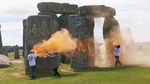 Anti-oil vandals attack Stonehenge with orange paint powder ahead of summer solstice celebrations in England. 