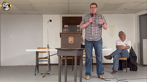 Premier Moe speaks to a town hall in Speers, Sask. in a video from May