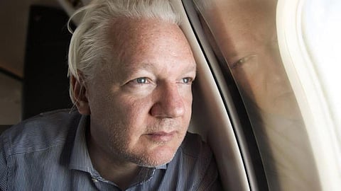 Julian Assange in a picture shared by Wikileaks on X, with a caption that reads, 'Approaching Bangkok airport for layover. Moving closer to freedom.' 
