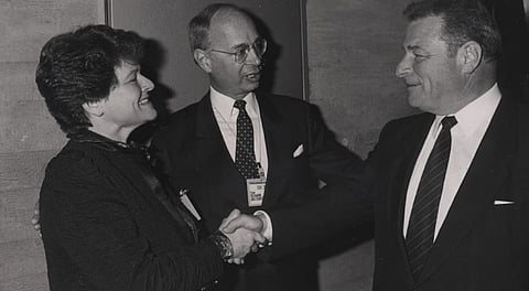 Gro Harlem Bruntland (left,) then prime  minister of Norway, meets with Klaus Schwab (centre) at the 1989 World Economic Forum. Bruntland went on to chair the World Health Organization but also prepared the eponymous Bruntland Report. Writer Murray Lytle cites her report as an example of using weasel words to promote an unpopular globalist strategy.