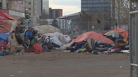 Tents set up near Quasar Bottle Depot on 95 Street and 105A Avenue