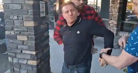WATCH: Tommy Robinson arrested, barred from leaving Calgary
