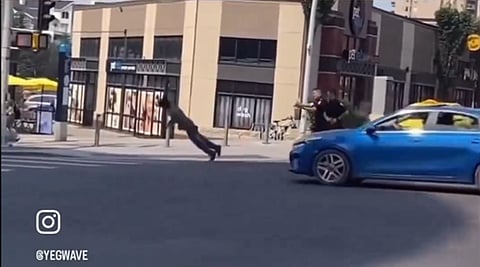 WATCH: Edmonton police tase man carrying a metal pole through traffic