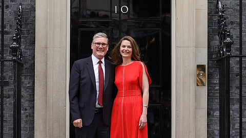 British Prime Minister Keir Starmer and his wife Victoria arrive at 10 Downing Street upon his appointment. 
