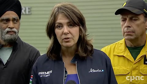 Alberta Premier Danielle Smith and Emergency Preparedness Minister Harjit Sajjan spoke with reporters in Hinton after a tour of the wildfire staging area.