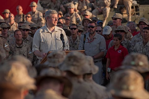 Then-Prime Minister Harper talks to the troops in Afghanistan, in 2011. More than 40,000 members of the Canadian Armed Forces served there during the 13 years that Canada was involved in the campaign to defeat the Taliban. Writer Ivan Beaudry, a recent veteran himself, asks why the Government of Canada has so little to say about veterans of today's wars...