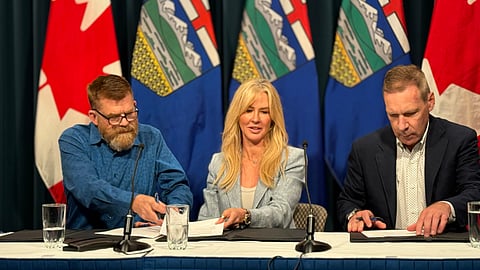 Energy Minister Brian Jean (l) along with Shell Canada country chair Susannah Pearce and ATCO COO Bob Myles (r) sign the first agreement to store captured CO2 in Calgary on Monday.
