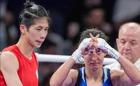 Svetlana Staneva, visibly upset after losing her boxing match to a XY chromosome boxer Lin Yu-Ting, makes a double X gesture to the audience.