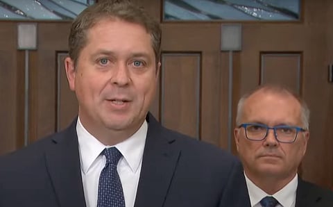 Conservative MPs Andrew Scheer and Luc Bertold tell reporters Tuesday that Canadians need to know how a man suspected of supporting ISIS and indeed participating in an ISIS execution video, could receive Canadian citizenship. The two asked that the House of Commons Public Safety Committee hold an emergency meeting.