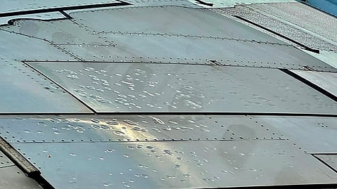 Hail damage to the flap section of a WestJet jet