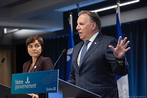 Francois Legault with Christine Frechette announced the first measure to reduce the number of temporary immigrants. 