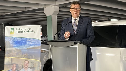 Premier Scott Moe stands in a parking facility nearing completion at Regina General Hospital