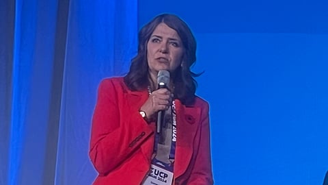 Premier Danielle Smith takes questions from members at the UCP 'bearpit' session Friday night, in The Westerner Park, Red Deer.