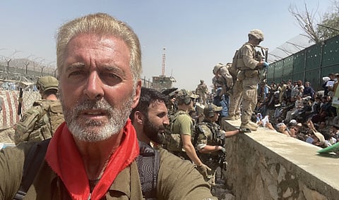 Retired Sergeant-Major Dave Lavery, a former JTF-2 member, worked hard to get Canada's Afghan allies to safety after the fall of Kabul in 2021. Now, he has himself been abducted by the Taliban. Columnist Linda Slobodian says this must now be a Canadian government priority to secure his release. He is shown here wearing the distinctive red bandana that alerted Afghans holding entry credentials for Canada, that he was the man who would get them on a plane.