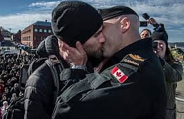 Master Seaman Francis Legare kissing his partner