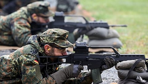 German reserve soldiers shoot rifles as they train in Germany, in October.