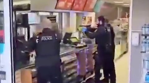 The moment police opened fire on the suspect.
