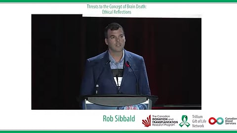 Rob Sibbald, shown here addressing a 2018 conference, suggests it may be time to update the "dead donor" rule for organ donations by people choosing medically-assisted deaths