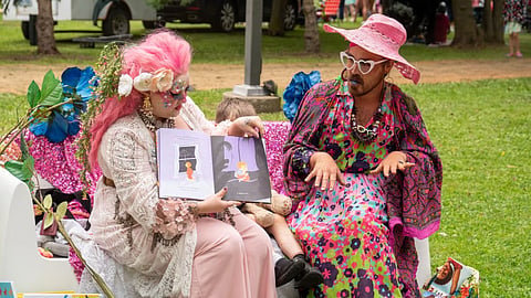 Drag queens read a story during the Teddy Bear Picnic in Thunder Bay, Ont., in July 2023.