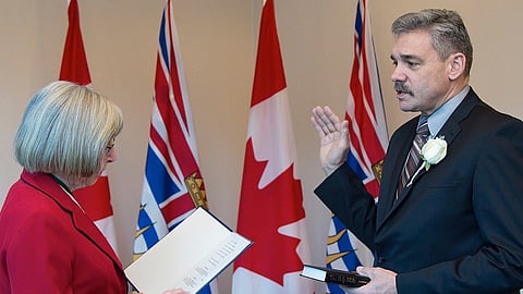 Mike Morris is sworn in as B.C. Minister of Public Safety and Solicitor General by former Lt. Gov. Judith Guichon, March 2015. He served 32 years in the RCMP before being elected to the B.C. legislature 
