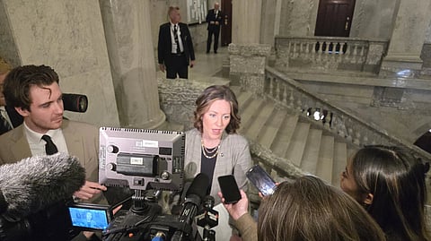 Alberta Environment Minister Rebecca Schulz in a media scrum at the Alberta Legislature 