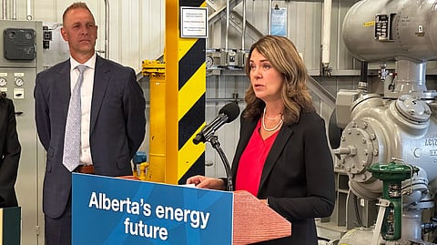 Premier Danielle Smith (right) with Nathan Neudorf, minister of affordability and utilities (left) in Calgary on Aug. 25. 
