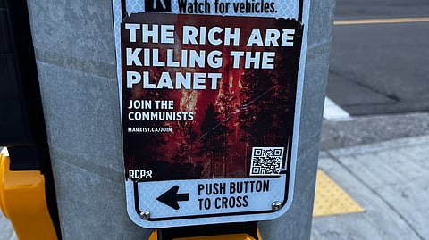 An RCP sign over a Pedestrian pushbutton 