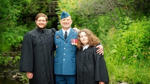 Master Warrant Officer Jeff Evely (Ret’d) with his son and daughter
