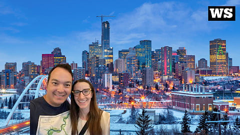 Travis Fong and Ashley Salvador next to the Edmonton Skyline