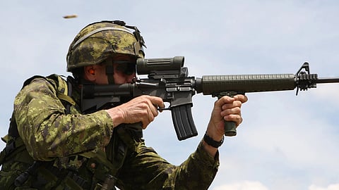 A Canadian soldier firing a C7A2 rifle produced by Colt Canada. 