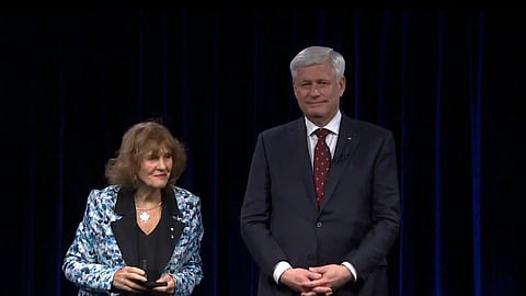 Harper receiving his medal