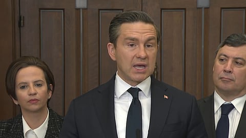 Poilievre speaking on Parliament Hill