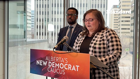 Sarah Hoffman and Sharif Haji speaking to reporters. 