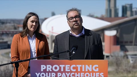 NDP Leader Naheed Nenshi speaking to reporters. 