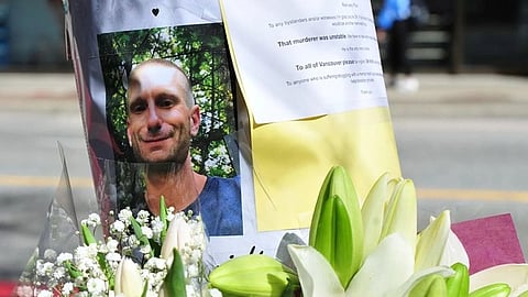 A memorial for stabbing victim Paul Stanley Schmidt, 37, is seen outside the Starbucks Reserve at West Pender and Granville streets in downtown Vancouver on March 28, 2023.