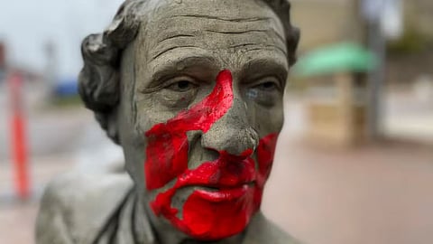 A vandalized statue of Sir John A. Macdonald 