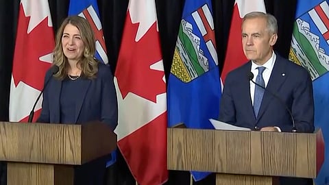 Premier Danielle Smith and Prime Minister Mark Carney in Calgary on May 15, 2026. 