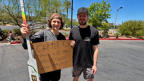 Vegas Golden Knights goaltender Carter Hart poses with a fan while wearing a “Free Alberta” T-shirt in Las Vegas.
