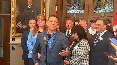 Avi Lewis speaking at a press conference on Parliament Hill